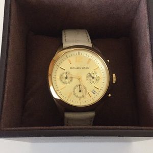 Michael Kors women’s watch | gold face white band